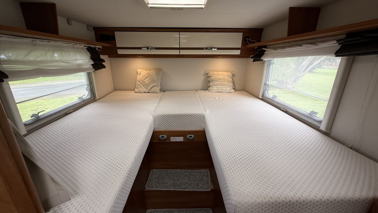 Sammy 4 berth campervan rental in New Zealand with bike rack, awning and twin bed